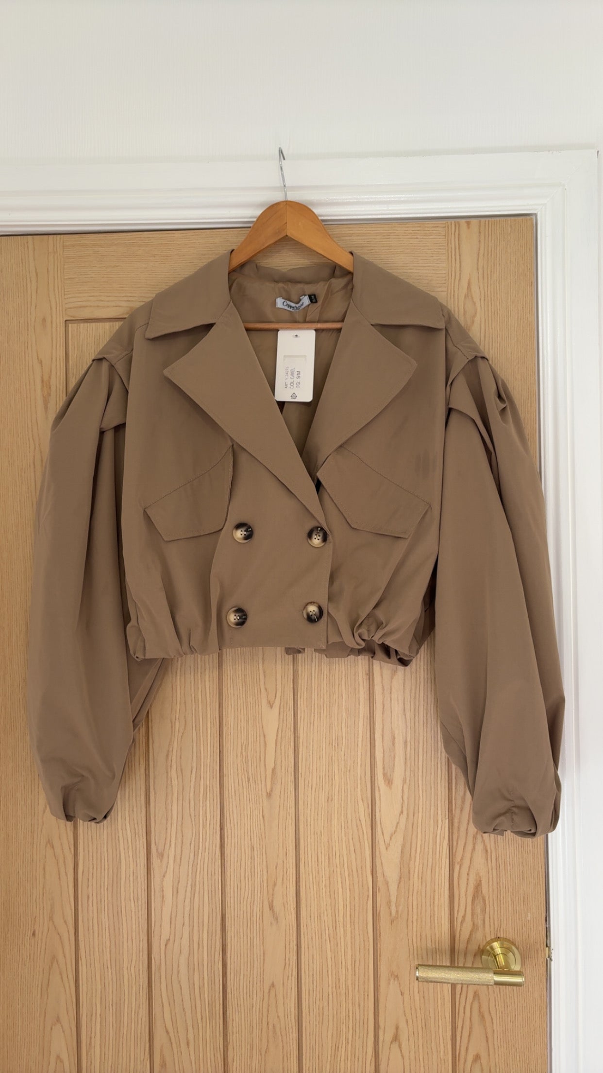 Cropped beige trench coat